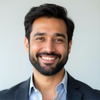 Professional headshot of Arjun Nair, Lead Automotive Reviewer